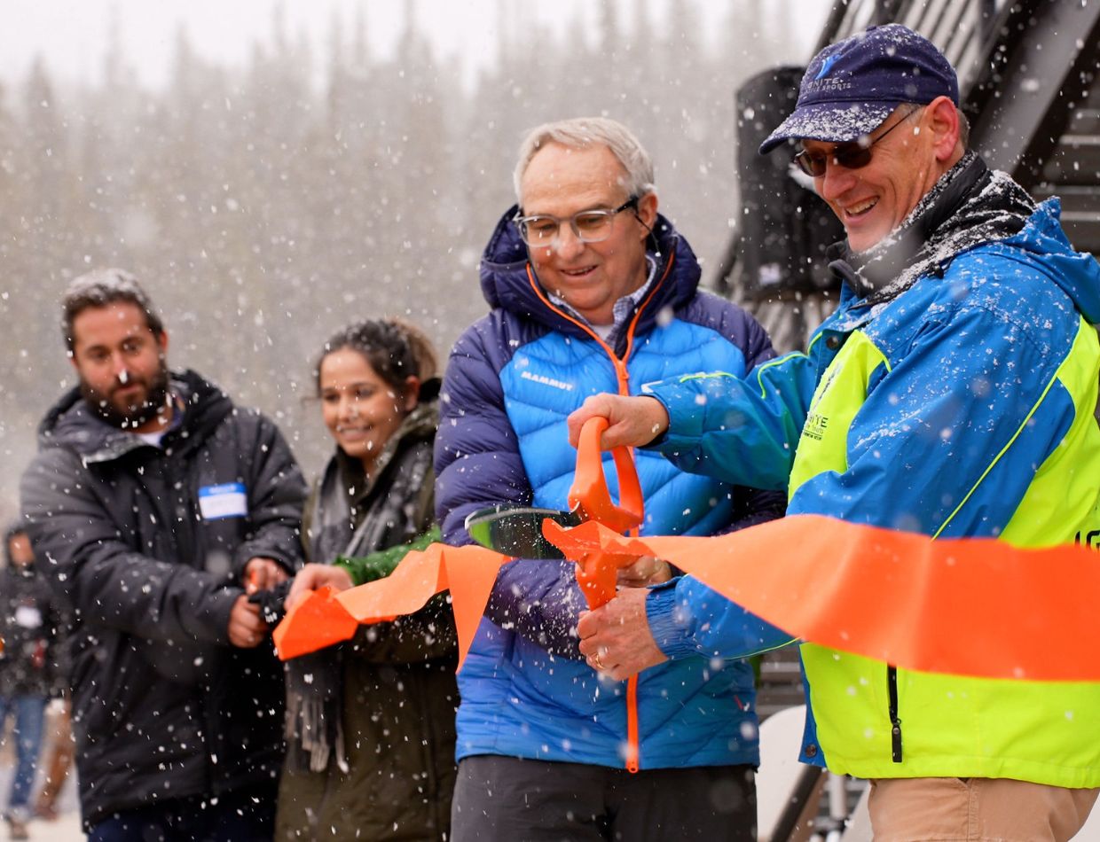 Ignite Adaptive Sports and Eldora Mountain Resorts team members cutting a ceremonial ribbon